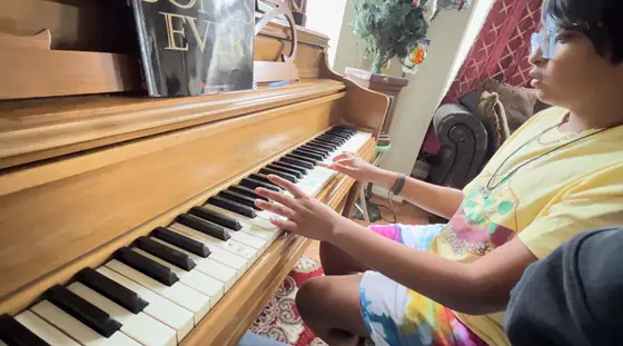 Student at the piano at Stars Music School, Inwood WV