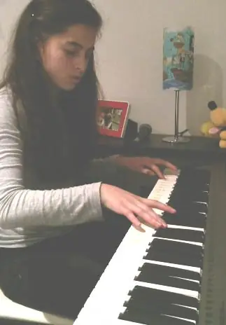 Student at the piano at Stars Music School, Inwood WV