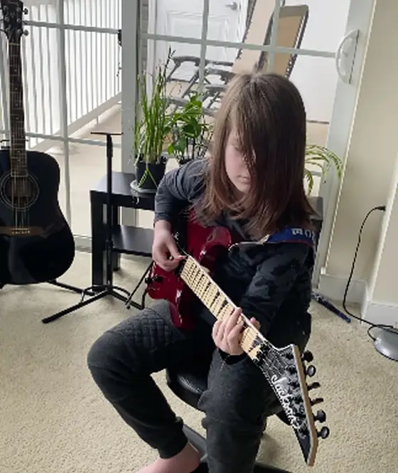 Student at the guitar at Stars Music School, Inwood WV