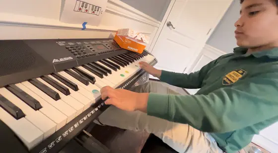 Student at the piano at Stars Music School, Inwood WV